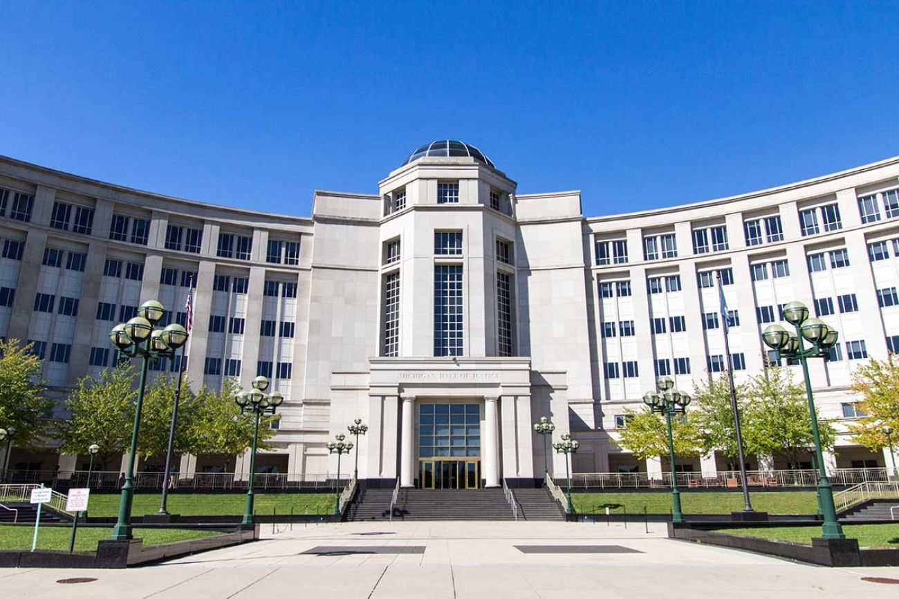 Image of the exterior of the Michigan Supreme court building on a sunny day 