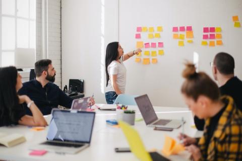 A group of staff in a meeting room